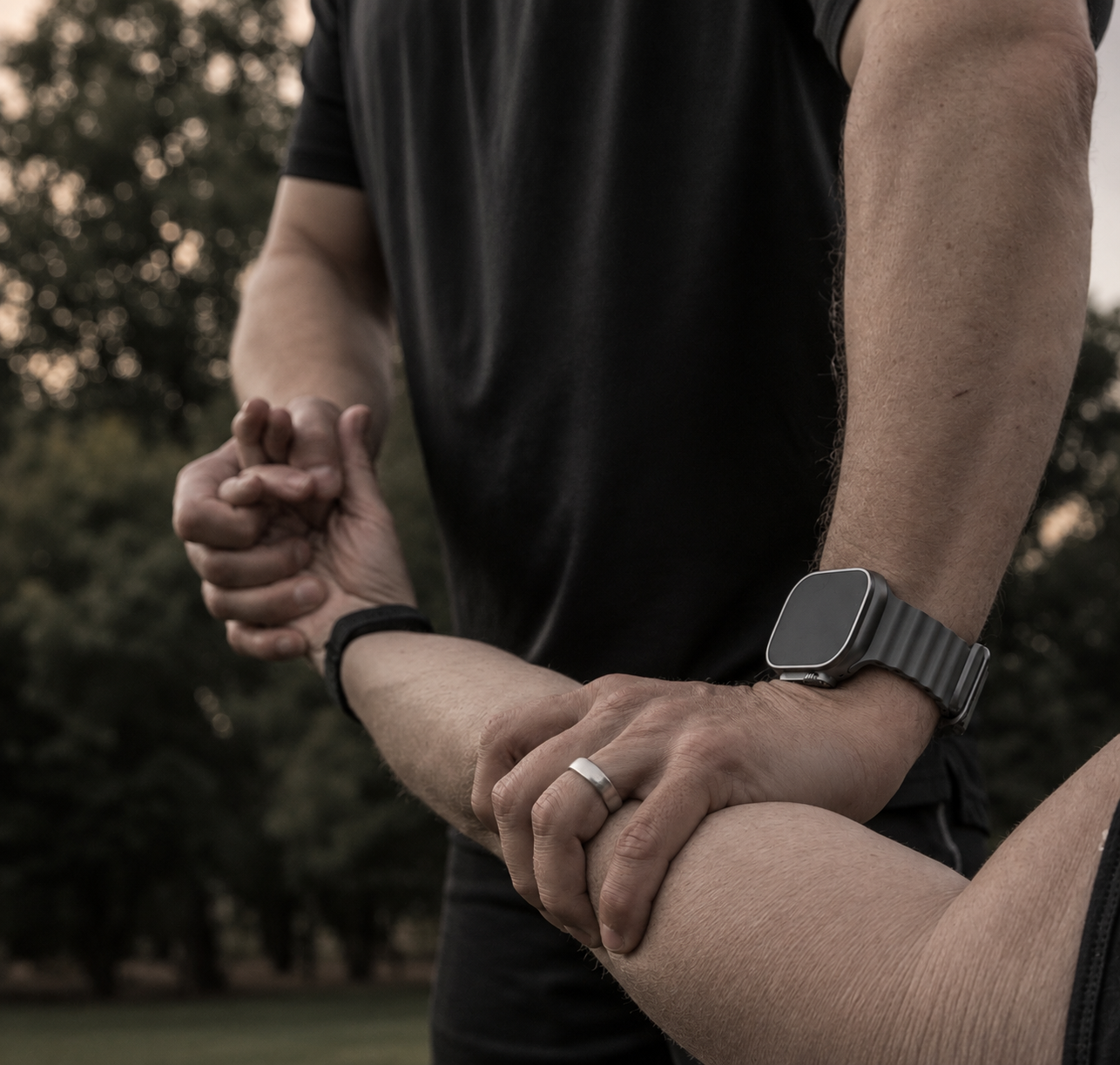 Instructor coaching a student through a wrist release